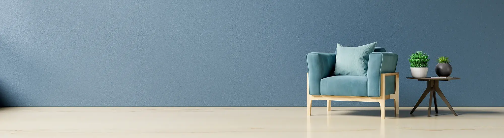 A calm armchair by a softly lit wall, an invitation to sit